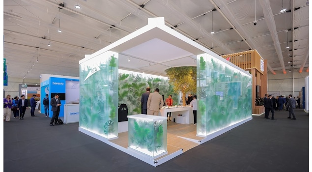 The RTA COP28 stand by Studio Königshausen in Dubai boasts an avant-garde design, featuring illuminated walls adorned with lush greenery, shaping an interactive, futuristic city model.